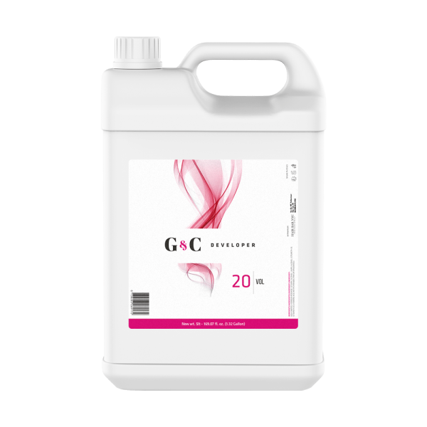A white plastic gallon container of G&C Cream Developer 20 Volume with a handle, screw cap, and a label featuring a pink abstract design.