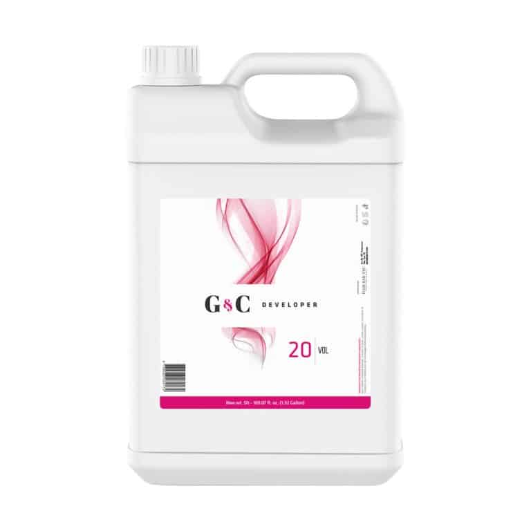 A white plastic gallon container of G&C Cream Developer 20 Volume with a handle, screw cap, and a label featuring a pink abstract design.