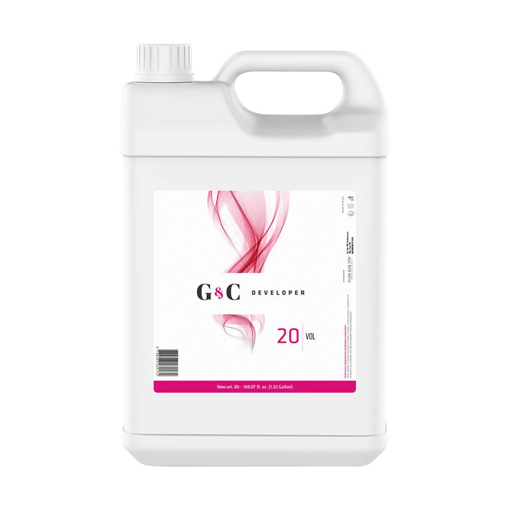 A white plastic gallon container of G&C Cream Developer 20 Volume with a handle, screw cap, and a label featuring a pink abstract design.