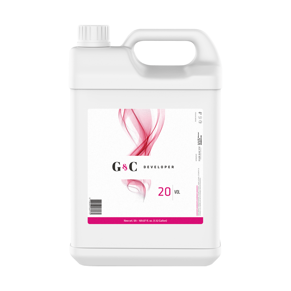 A white plastic gallon container of G&C Cream Developer 20 Volume with a handle, screw cap, and a label featuring a pink abstract design.