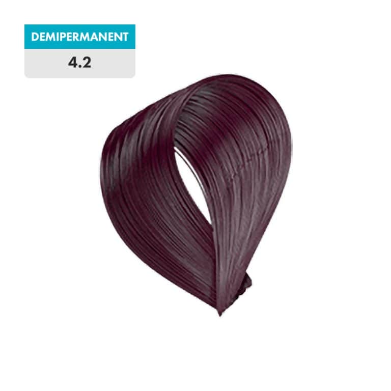 A swatch of 4.2 - Medium Violet Brown (Demipermanent) hair dye, a rich medium violet brown shade, is displayed against a green background.