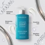 A blue bottle of Hair Bar NYC Ultimate Repair System Styling Cream delivers hydrolyzed keratin, moisturizing care, smooth and weightless styling. Cream swirls are visible.