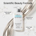 A bottle of Silk Touch System Shampoo, featuring hydrolyzed keratin, smoothing polymers, and color-safe care, stands before a metallic backdrop with molecular graphics.