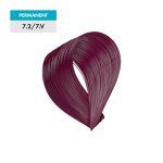A swatch of 7.2 / 7.V - Medium Violet Blonde permanent hair dye displays a deep burgundy color against a green background.