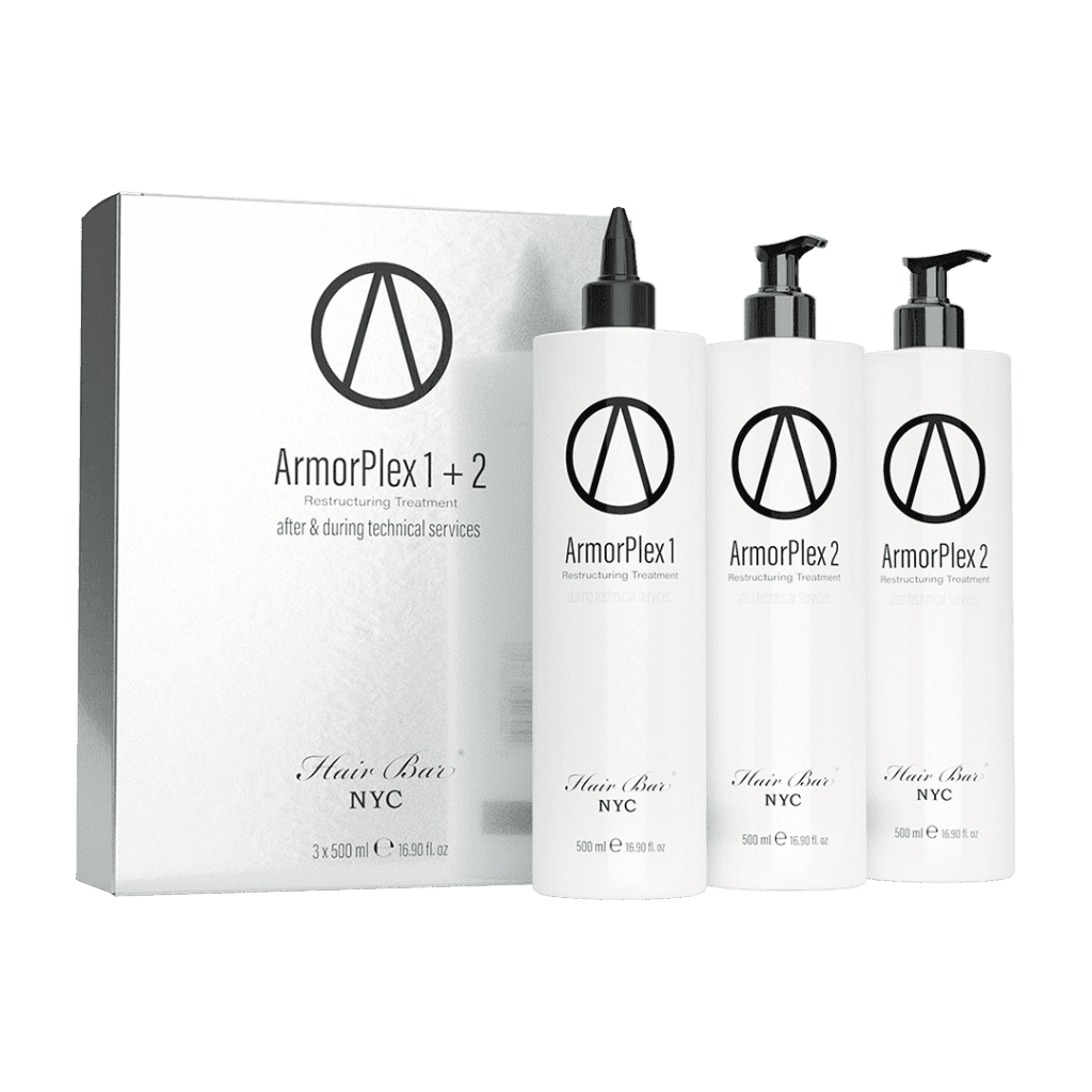 Three white bottles labeled ArmorPlex Restructuring Treatment stand beside a matching Hair Bar NYC box, created to complement diamond botox hair therapies.