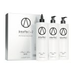 Three white bottles labeled ArmorPlex Restructuring Treatment stand beside a matching Hair Bar NYC box, created to complement diamond botox hair therapies.