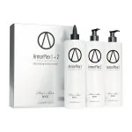 Three white bottles labeled ArmorPlex Restructuring Treatment stand beside a matching Hair Bar NYC box, created to complement diamond botox hair therapies.