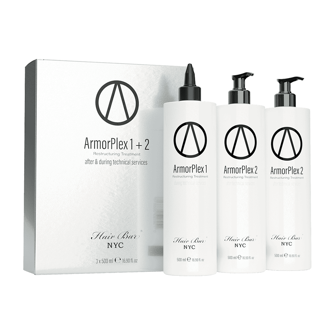 Three white bottles labeled ArmorPlex Restructuring Treatment stand beside a matching Hair Bar NYC box, created to complement diamond botox hair therapies.