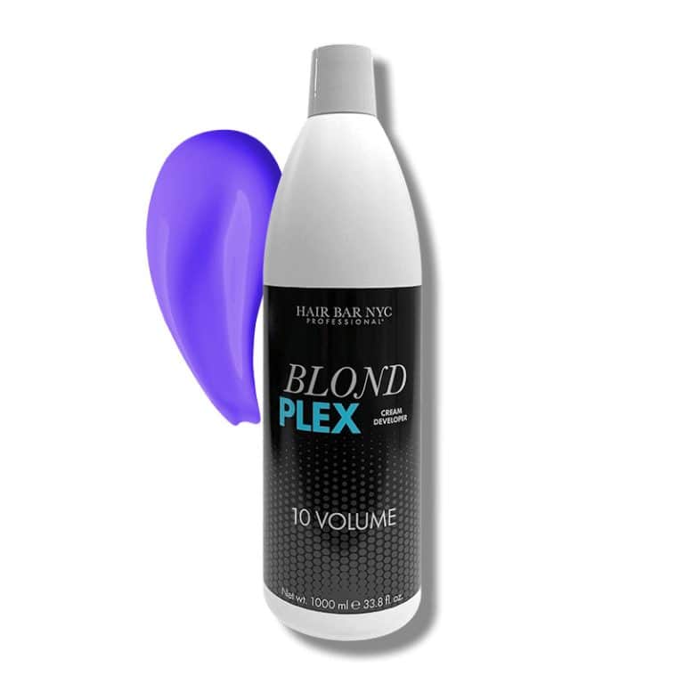 A bottle of Blond Plex Violet Developer 10 Volume is placed beside a smear of purple cream developer on a plain background.