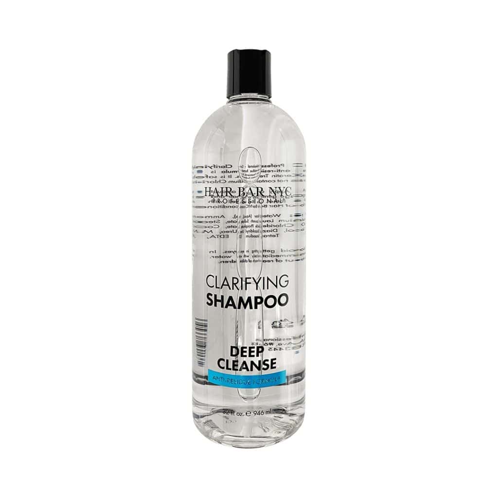 A clear plastic bottle of Clarifying Shampoo 32 oz by Hair Bar NYC, featuring a black cap and printed label, contains 946 ml of product.