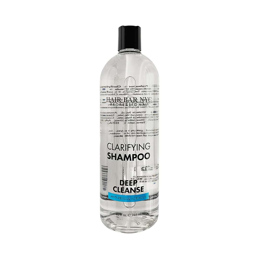 A clear plastic bottle of Clarifying Shampoo 32 oz by Hair Bar NYC, featuring a black cap and printed label, contains 946 ml of product.