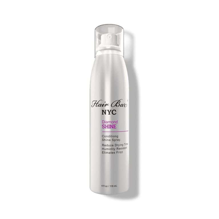 A silver aerosol can of Diamond Shine spray from Hair Bar NYC, featuring product details and a clear plastic cap.