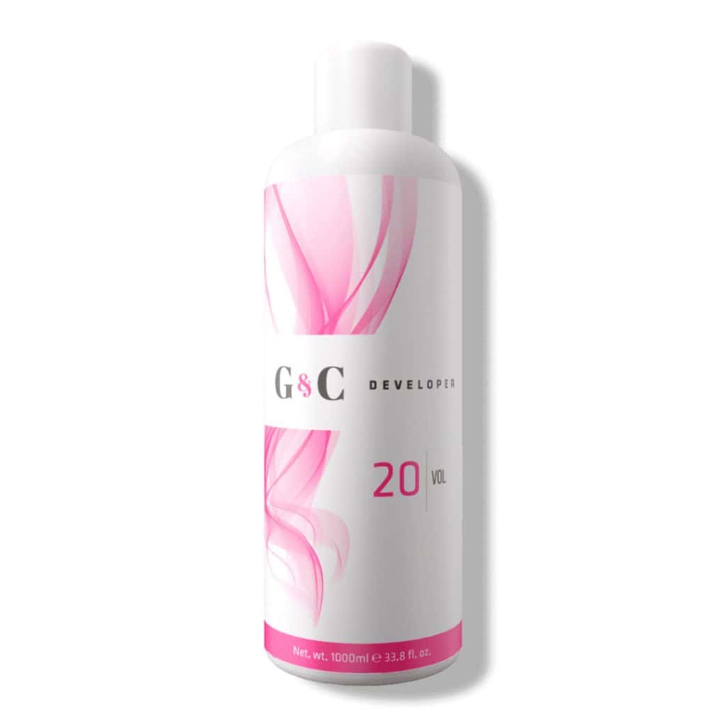A 1000ml (33.8 fl oz) white bottle of G&C Cream Developer 20 Volume, labeled with pink abstract designs.