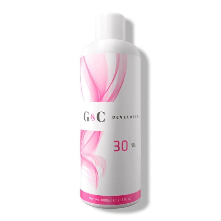 A 1000 ml (33.8 fl oz) white bottle labeled "G&C Cream Developer 30 Volume" with pink abstract designs.