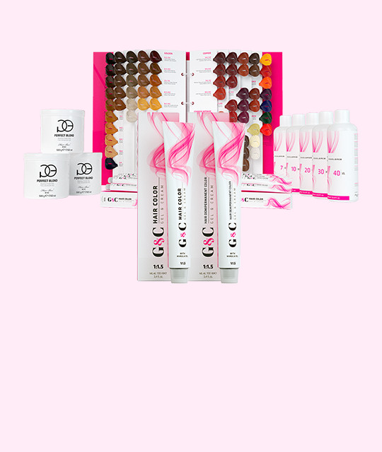 Assorted hair coloring products, including color swatches, developer bottles, hair color tubes, and powder bleach containers, arranged on a pink background.