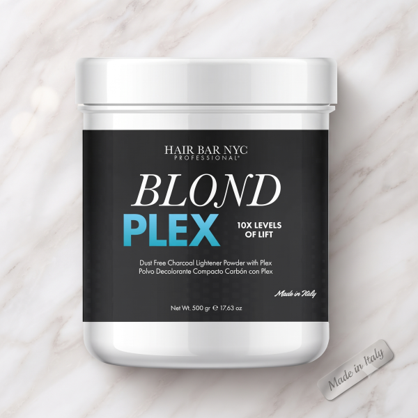A 500g container of Blond Plex Charcoal Lightener Powder, labeled for 10X levels of lift, sits on a marble surface.
