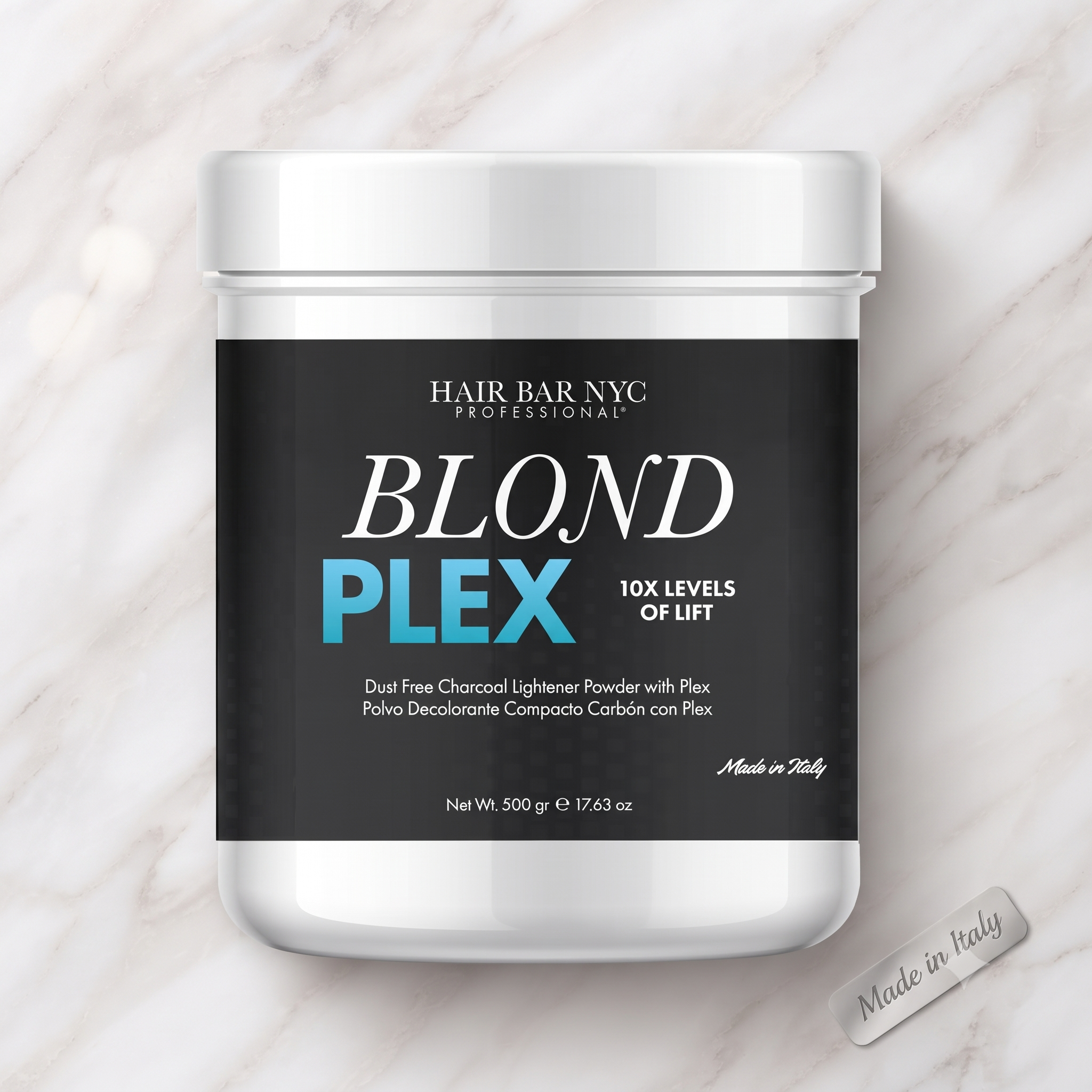 A 500g container of Blond Plex Charcoal Lightener Powder, labeled for 10X levels of lift, sits on a marble surface. A 500g container of Blond Plex Charcoal Lightener Powder, labeled for 10X levels of lift, sits on a marble surface.