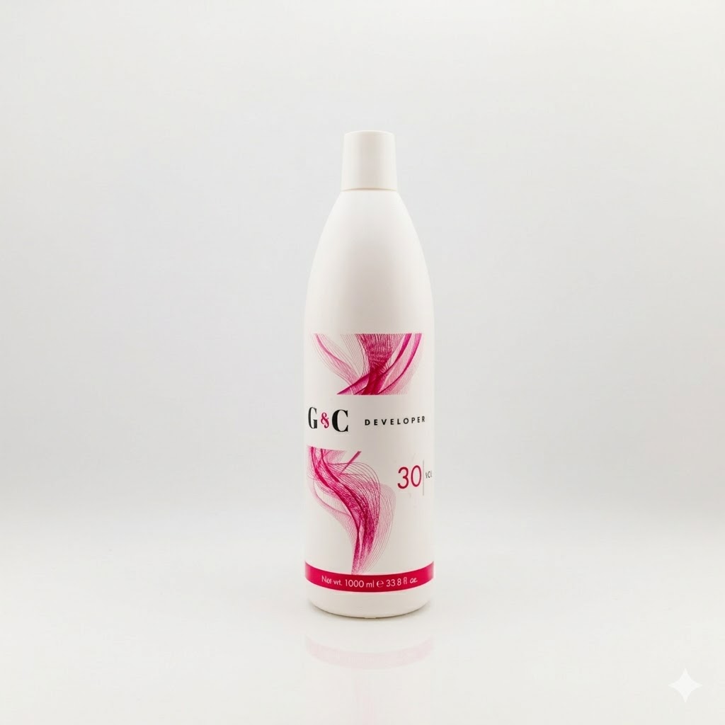 A 1000 ml (33.8 fl oz) white bottle of G&C Cream Developer 30 Volume with pink abstract designs stands against a plain white background.