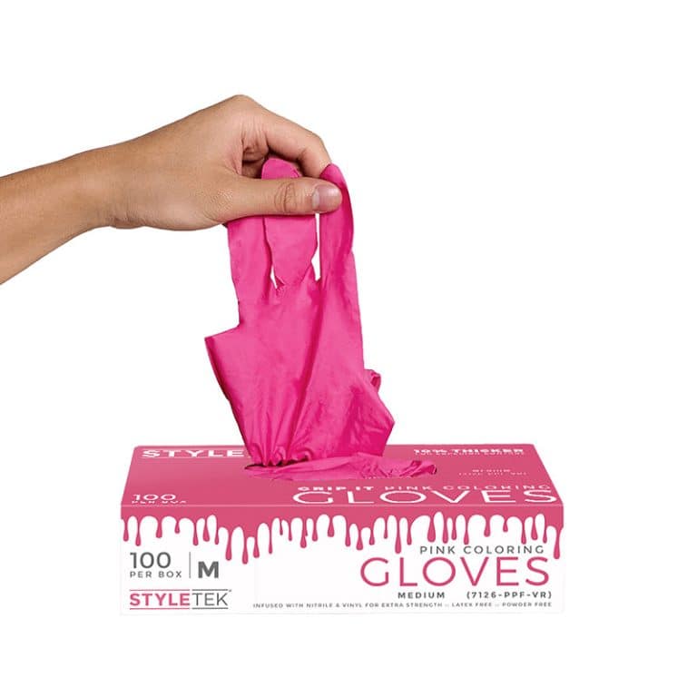 A hand pulls a pink glove from a box labeled "Pink Deluxe Vinyl Gloves - Powder Free, Medium, 100 per box," highlighting the quality and convenience of these stylish gloves.