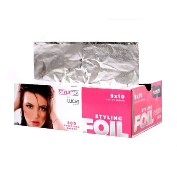 A pink and white "Pop Up Foil 9 x 11 – Heavy Emboss (500CT)" box with a woman's face dispenses 500 pre-folded, silver foil sheets, each measuring 9x11 inches.