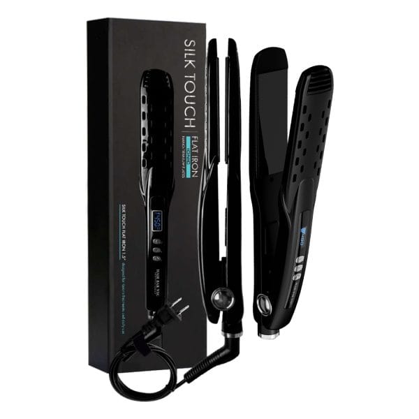 The Silk Touch Professional Ionic Flat Iron, a black hair straightener with digital display, control buttons, and power cord, is shown next to its packaging—ideal for sleek styles or use with diamond botox treatments for added shine.