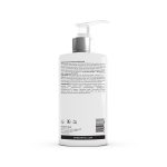 A white pump bottle of Silk Touch System Conditioner is shown from the back, featuring the product description, ingredients list, and branding details.