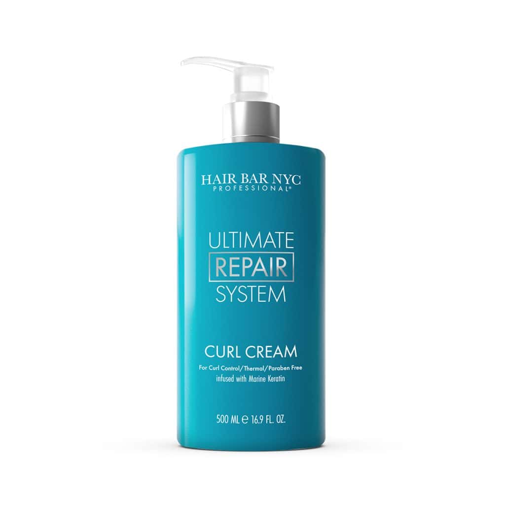 The 500 ml blue bottle of Hair Bar NYC Professional Ultimate Repair System Curl Cream pairs perfectly with the Ultimate Repair System Conditioner for revitalized, defined curls.