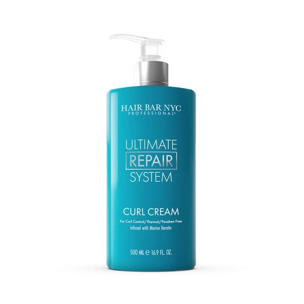 The 500 ml blue bottle of Hair Bar NYC Professional Ultimate Repair System Curl Cream pairs perfectly with the Ultimate Repair System Conditioner for revitalized, defined curls.