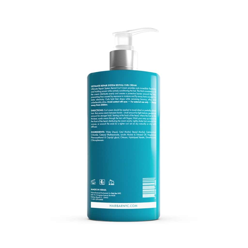 A teal bottle with a pump dispenser displays the back label showing directions, ingredients, barcode, and branding for the Ultimate Repair System Conditioner hair care product.