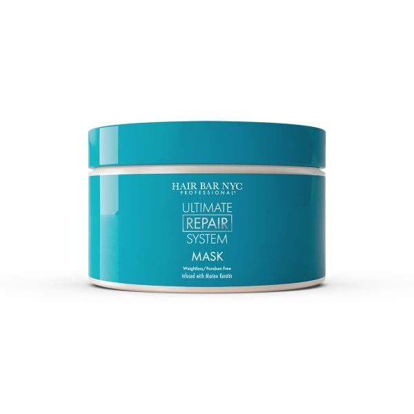 A turquoise jar labeled "Hair Bar NYC Professional Ultimate Repair System Conditioner" with a white lid sits on a white background, highlighting the ultimate repair conditioner for damaged hair.