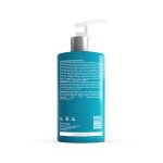A teal pump bottle of shampoo with detailed info and ingredients on the back pairs perfectly with Ultimate Repair System Conditioner for a complete hair care routine.