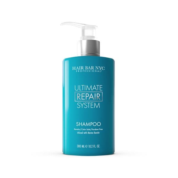 A blue pump bottle labeled "Hair Bar NYC Professional Ultimate Repair System Shampoo," 300 ml, with keratin and marine keratin, sulfate and paraben free—pairs perfectly with Ultimate Repair System Conditioner for complete hair restoration.