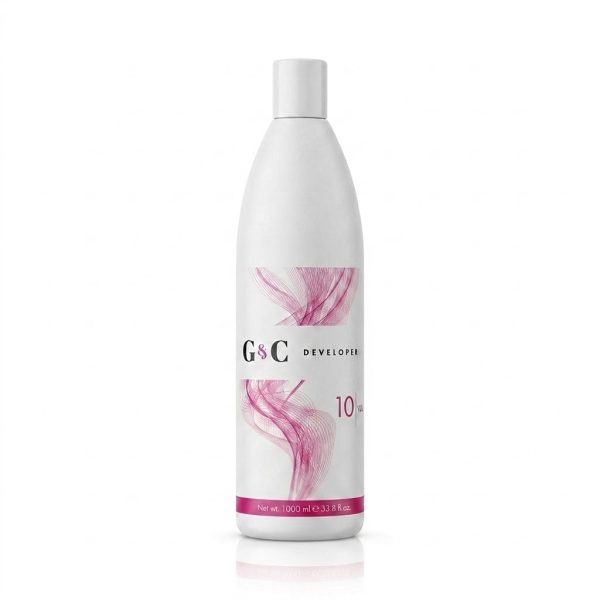 A 1000 ml white bottle of G&C Cream Developer 10 Volume features a pink abstract design and white cap, shown against a plain white background.