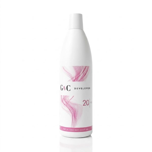 A 1000 ml (33.8 fl oz) white bottle of G&C Cream Developer 20 Volume, featuring a pink abstract design, is shown on a white background.