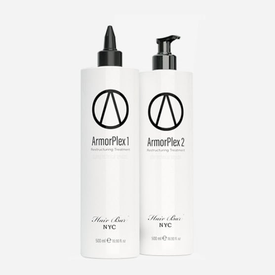Two white bottles labeled ArmorPlex 1 and ArmorPlex 2 Restructuring Treatment from Hair Bar NYC, one with a pointed nozzle and one with a pump dispenser, each 500 ml.