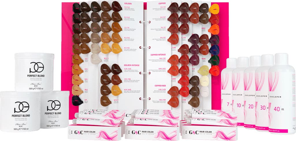 A display of hair color samples, hair color tubes, developer bottles, and tubs of hair products arranged neatly, showcasing a professional hair coloring kit.