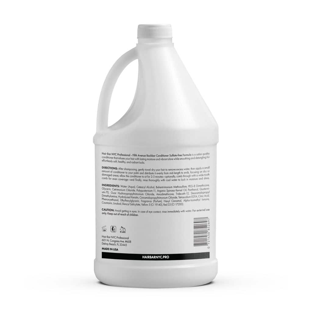 A white plastic gallon bottle of Backbar Shampoo Gallon features a printed label with directions, ingredients, and caution information for hair care.