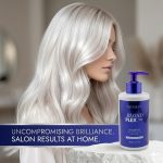 A woman with long, silver-blonde hair stands next to Blond Plex Platinum System Shampoo, with text highlighting salon-quality results you can achieve at home.
