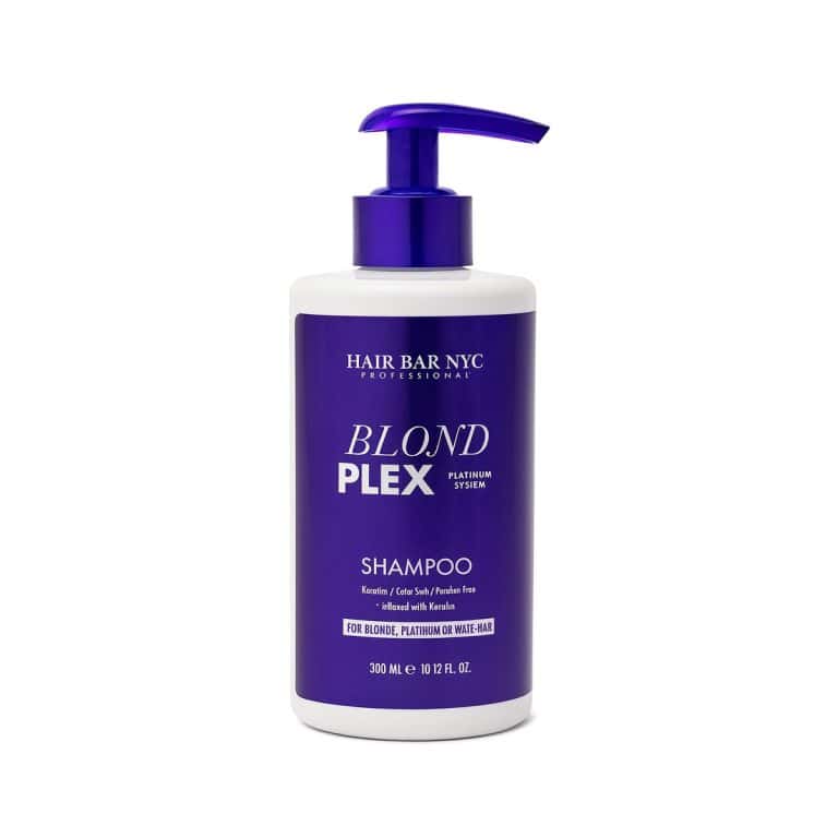 A bottle of Blond Plex Platinum System Shampoo, featuring a purple pump and label, formulated for blonde, platinum, or highlighted hair.
