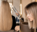 Side-by-side images showing a woman with long straight blonde hair before a haircut and with a short, straight blonde bob after the haircut.