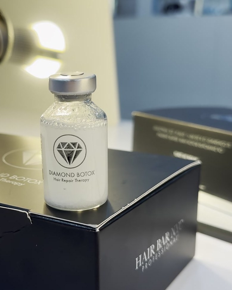 Diamond Botox ampoule on its black box at a Hair Bar NYC salon station